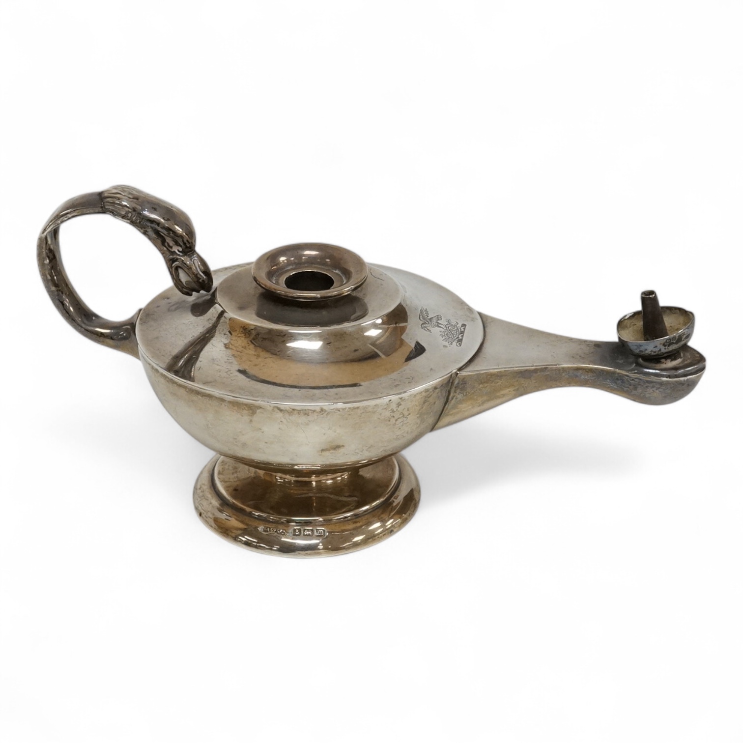 A George V Asprey & Co silver table lighter, modelled as an 'Aladdin' oil lamp, Birmingham, 1911, length 16cm, weighted.
